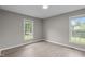Bedroom with wood floors and two large windows at 5804 Heathill Ct, Raleigh, NC 27603