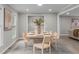 Dining room features modern table and seating with lots of natural light at 5804 Heathill Ct, Raleigh, NC 27603