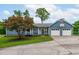 Charming exterior featuring a two-car garage and basketball hoop, with curb appeal and functionality at 5804 Heathill Ct, Raleigh, NC 27603