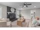 Living room featuring a painted brick fireplace, modern furniture, and bright natural light at 5804 Heathill Ct, Raleigh, NC 27603