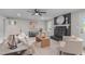 Living room featuring a painted brick fireplace, modern furniture, and bright natural light at 5804 Heathill Ct, Raleigh, NC 27603