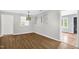 Large dining room with access to the kitchen and bedrooms, and lots of natural light at 5805 Craig Rd, Durham, NC 27712