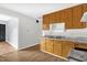 Kitchen features wood cabinets, marble look countertops, and a stainless steel sink at 5805 Craig Rd, Durham, NC 27712