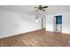 Large living room with neutral paint, a ceiling fan, and wood-look floors at 5805 Craig Rd, Durham, NC 27712