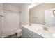 Bathroom with double sink vanity and shower-tub combo at 61 Merrifield Ln, Garner, NC 27529