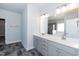 Bathroom with double sink vanity and separate glass-enclosed shower at 61 Merrifield Ln, Garner, NC 27529