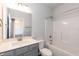 Bathroom features a shower-tub combo, vanity, and great lighting at 61 Merrifield Ln, Garner, NC 27529