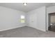 Bedroom featuring a double door closet, plush carpeting, and natural light at 61 Merrifield Ln, Garner, NC 27529