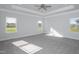 Bright and spacious bedroom with multiple windows offering ample natural light at 61 Merrifield Ln, Garner, NC 27529