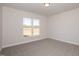 Bedroom with large window and plush carpeting at 61 Merrifield Ln, Garner, NC 27529