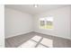 Bedroom with large window and plush carpeting at 61 Merrifield Ln, Garner, NC 27529