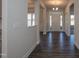 Bright and spacious foyer with hardwood floors and elegant lighting, showcasing the home's entry at 61 Merrifield Ln, Garner, NC 27529