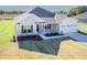 Charming single Gathering home boasts neutral siding and a well-kept front lawn at 61 Merrifield Ln, Garner, NC 27529