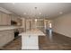 Modern kitchen with stainless steel appliances, grey cabinets, and granite countertops at 61 Merrifield Ln, Garner, NC 27529