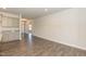 Open-concept living area featuring hardwood floors with a view into the kitchen at 61 Merrifield Ln, Garner, NC 27529