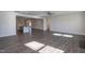 Open concept living room flows from the kitchen, featuring wood flooring and modern lighting at 61 Merrifield Ln, Garner, NC 27529