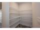 Spacious walk-in pantry with multiple levels of wire shelving, perfect for organized storage at 61 Merrifield Ln, Garner, NC 27529