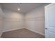 Walk-in closet offering ample storage with built-in shelving at 61 Merrifield Ln, Garner, NC 27529