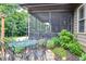 A backyard featuring a patio, screened porch, and garden table at 67 Marshlane Way, Clayton, NC 27527