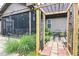Cozy backyard with a screened porch, pergola and patio perfect for outdoor dining and entertaining at 67 Marshlane Way, Clayton, NC 27527