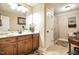 Bathroom features a large mirror, vanity, toilet, and shower with patterned rug at 67 Marshlane Way, Clayton, NC 27527