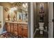 This bathroom has a double vanity, a large mirror, and a separate toilet room at 67 Marshlane Way, Clayton, NC 27527
