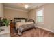 This bedroom features a ceiling fan and a window to let in the sunlight at 67 Marshlane Way, Clayton, NC 27527