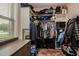 Walk-in closet featuring built-in shelving and drawers for ample storage space at 67 Marshlane Way, Clayton, NC 27527