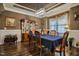 Formal dining area with wainscoting, display cabinet, and an elegant chandelier at 67 Marshlane Way, Clayton, NC 27527