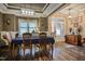 Formal dining room features hardwood floors, tray ceilings, and elegant chandelier lighting at 67 Marshlane Way, Clayton, NC 27527