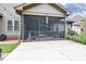 Exterior screened in porch features outdoor seating and patio for backyard grilling at 67 Marshlane Way, Clayton, NC 27527