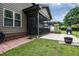 Exterior of a home with a screened porch and a patio area for outdoor enjoyment at 67 Marshlane Way, Clayton, NC 27527