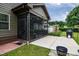 Exterior view of a screened porch and patio featuring outdoor barbecue at 67 Marshlane Way, Clayton, NC 27527