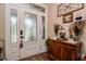 Welcoming foyer with decorative glass doors, hardwood floors, and elegant decor at 67 Marshlane Way, Clayton, NC 27527