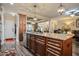 Spacious kitchen featuring an island, custom cabinets, and stainless steel appliances at 67 Marshlane Way, Clayton, NC 27527