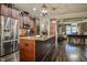 Spacious kitchen features an island with a granite countertop and stainless steel appliances at 67 Marshlane Way, Clayton, NC 27527