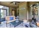 Comfortable screened porch with stylish outdoor furniture, perfect for entertaining or relaxation at 67 Marshlane Way, Clayton, NC 27527