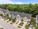 Aerial view of townhomes, showcasing the well-maintained roofs and landscaping at 740 Treviso Ln, Apex, NC 27502