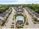 Aerial view of a neighborhood with a community pool and lush green landscaping at 740 Treviso Ln, Apex, NC 27502