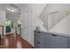 Bright foyer with hardwood floors, storage console, and staircase at 740 Treviso Ln, Apex, NC 27502