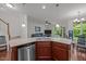 Open-concept kitchen with a view into the living and dining areas at 740 Treviso Ln, Apex, NC 27502