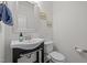 Cozy half bathroom with a stylish sink vanity, toilet, and decorative mirror at 740 Treviso Ln, Apex, NC 27502