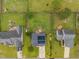 Aerial view of a home featuring a spacious backyard, solar panels, and neighborhood at 76 Haywood St, Spring Lake, NC 28390