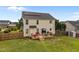 Spacious backyard featuring a wooden deck, fenced yard, and manicured lawn at 76 Haywood St, Spring Lake, NC 28390