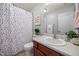 Full bathroom with a vanity, toilet, and shower/tub combination at 76 Haywood St, Spring Lake, NC 28390