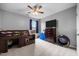This bedroom includes a TV on a dresser, lofted bed, and decor creating a comfortable space at 76 Haywood St, Spring Lake, NC 28390