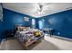 Vibrant bedroom featuring a bed, ceiling fan, and decor at 76 Haywood St, Spring Lake, NC 28390