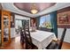 Dining room with wood floors, decorative lighting, and a view into the living room and kitchen at 76 Haywood St, Spring Lake, NC 28390