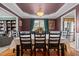Dining room with wood floors, decorative lighting, and a view into the living room and kitchen at 76 Haywood St, Spring Lake, NC 28390