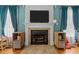 Elegant fireplace with decorative mantle, tiled hearth, and built-in shelving at 76 Haywood St, Spring Lake, NC 28390